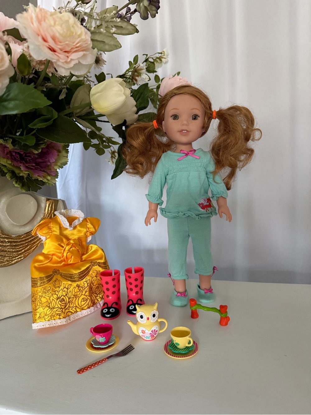 American Girl Wellie Wisher Willa in pajamas and additional dress and tea set